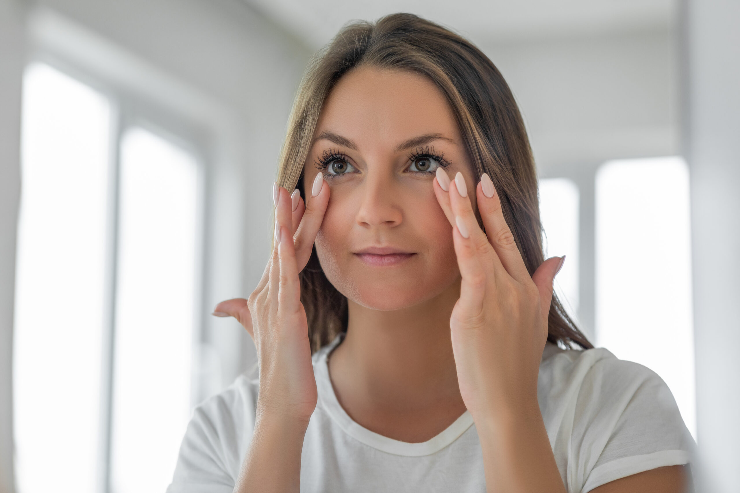 Woman looking at undereye up close
