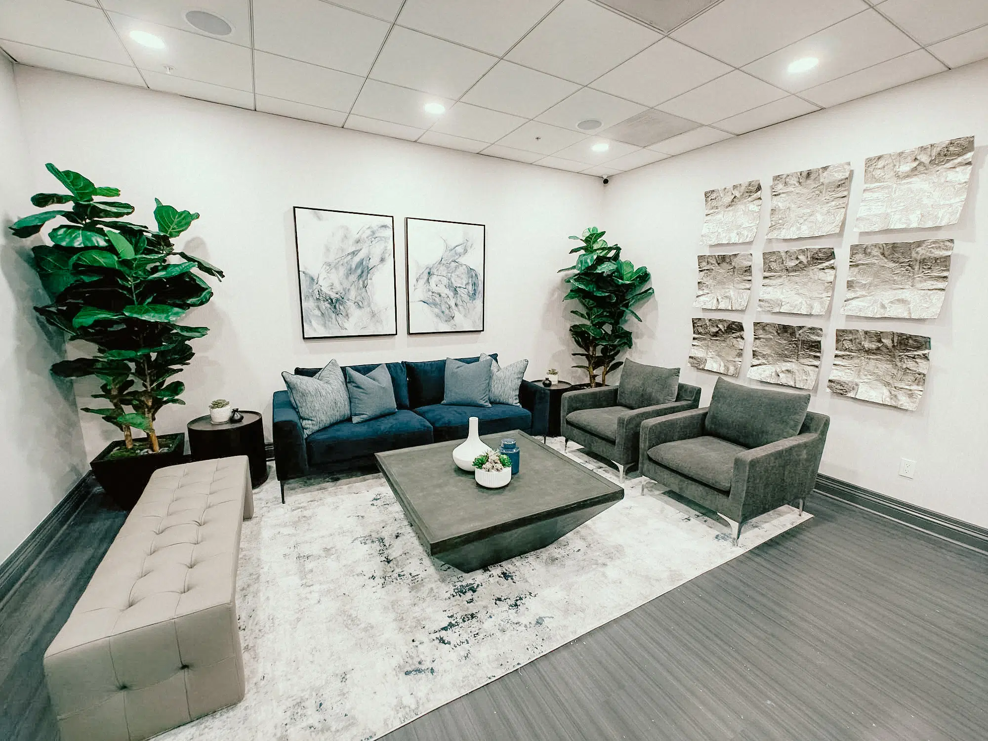 The stylish and serene lobby of Bloom Med Spa’s Riverside location, featuring a modern reception desk, comfortable seating, and soft lighting.