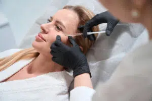 Sculptra is an injectable dermal filler designed to combat signs of aging by stimulating the body’s natural collagen production. The treatment involves injecting poly-L-lactic acid (PLLA), a biocompatible and biodegradable substance, into the skin to gradually restore volume and improve skin texture. Unlike other fillers that provide immediate results, Sculptra works over several months, providing subtle, natural-looking enhancements that can last up to two years. It is commonly used to treat deep wrinkles, folds, hollow areas, and for facial contouring in regions like the cheeks, temples, jawline, chest, and buttocks.